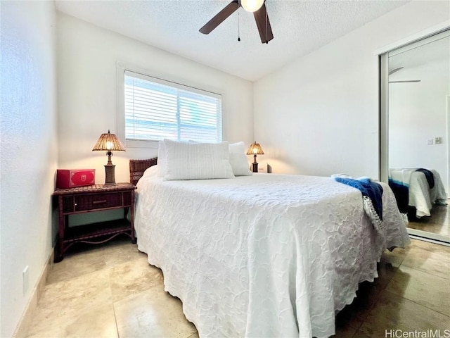 bedroom with a textured ceiling, a closet, and ceiling fan