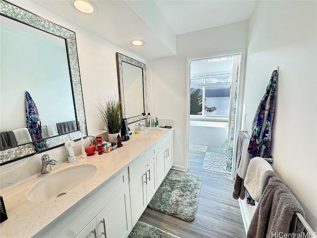 bathroom featuring vanity and hardwood / wood-style floors