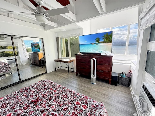 living room with ceiling fan and light hardwood / wood-style floors