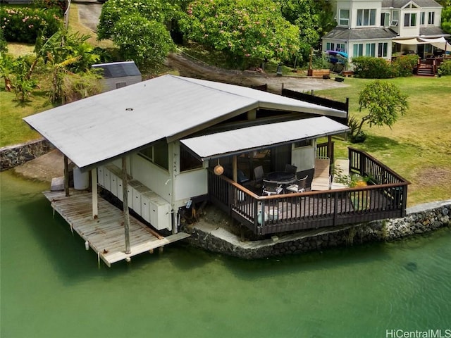 rear view of property featuring a water view