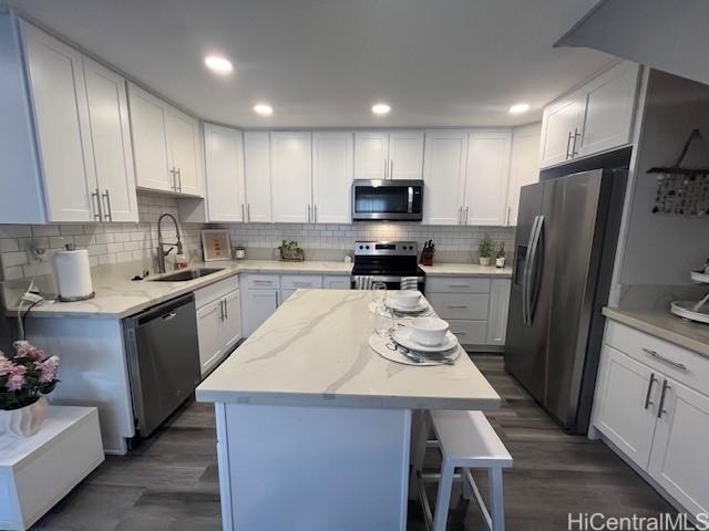 kitchen featuring sink, white cabinets, and stainless steel appliances