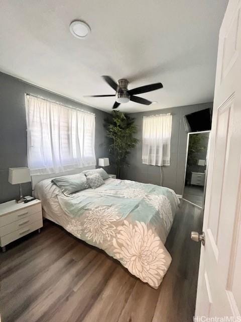 bedroom featuring hardwood / wood-style flooring and ceiling fan