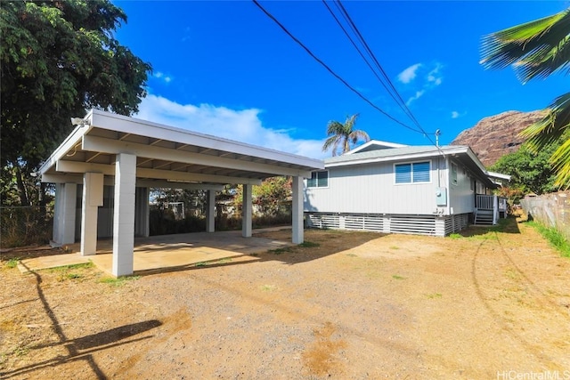 exterior space featuring a carport