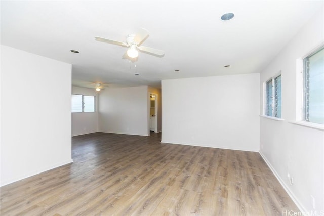 spare room featuring ceiling fan and light wood-type flooring