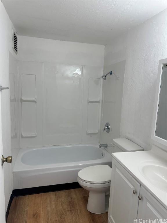 full bathroom featuring shower / tub combination, hardwood / wood-style floors, vanity, and toilet