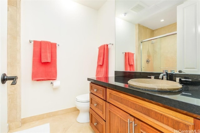 bathroom with tile patterned floors, walk in shower, vanity, and toilet