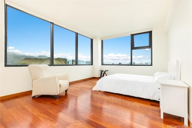 bedroom with hardwood / wood-style flooring