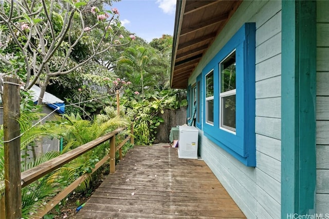 view of side of property with a wooden deck