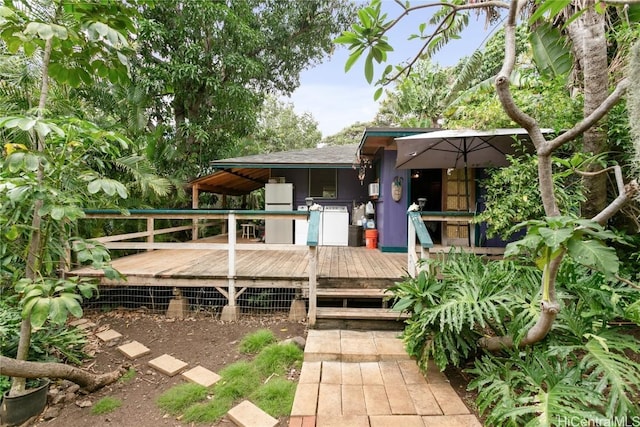 back of property with a wooden deck
