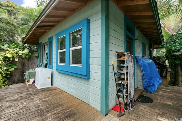 view of home's exterior with a wooden deck