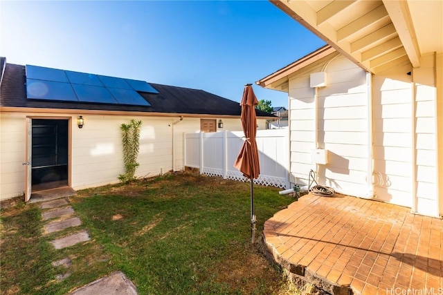 view of yard featuring fence and a patio