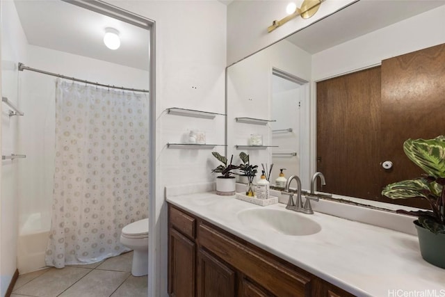 full bathroom featuring toilet, vanity, tile patterned flooring, and shower / tub combo