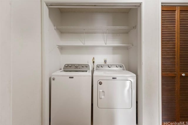 laundry room featuring washing machine and dryer