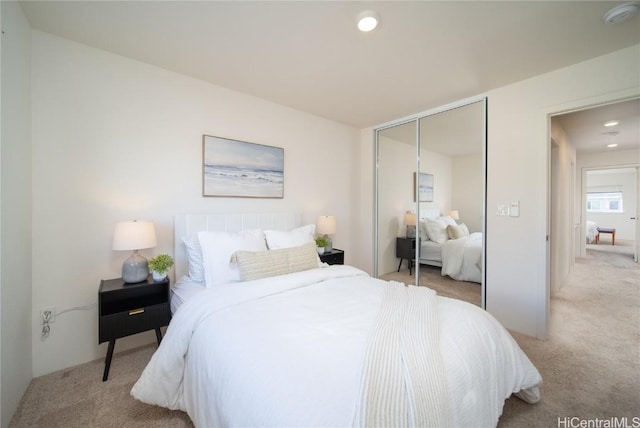 carpeted bedroom featuring a closet