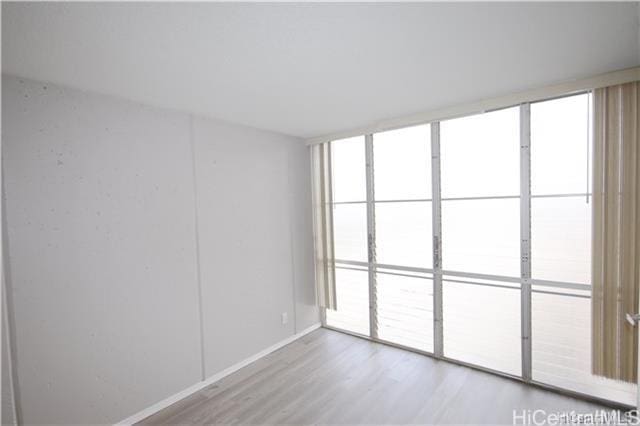 empty room featuring hardwood / wood-style flooring