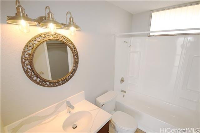 full bathroom featuring vanity, bathing tub / shower combination, and toilet