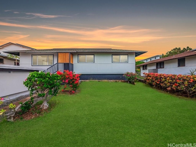 view of front of home with a lawn