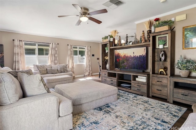 living room featuring ceiling fan, hardwood / wood-style flooring, and ornamental molding