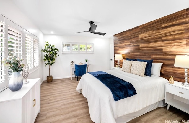 bedroom featuring ceiling fan and light hardwood / wood-style floors