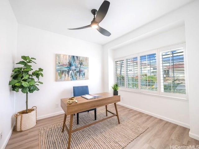 home office featuring light wood-type flooring and ceiling fan