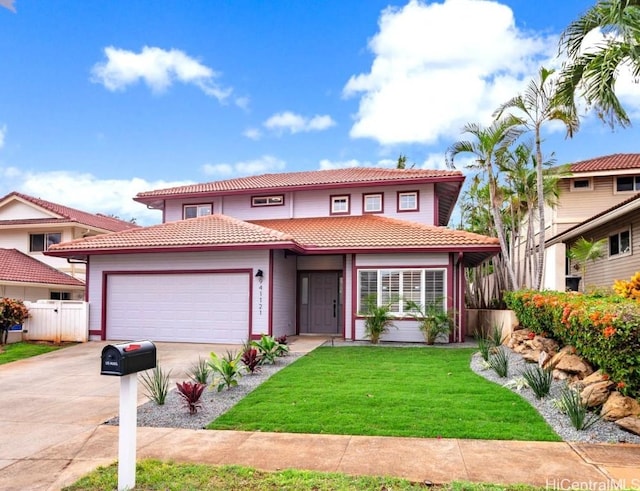 mediterranean / spanish home featuring a front lawn