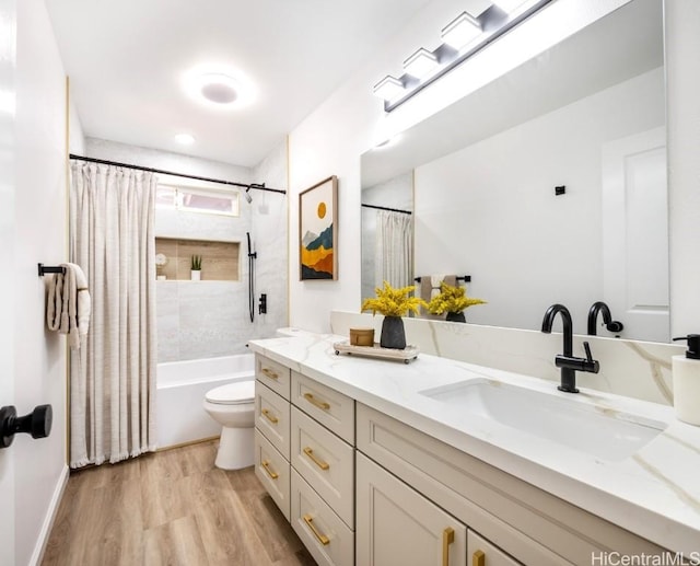 full bathroom featuring toilet, vanity, shower / bath combination with curtain, and wood-type flooring