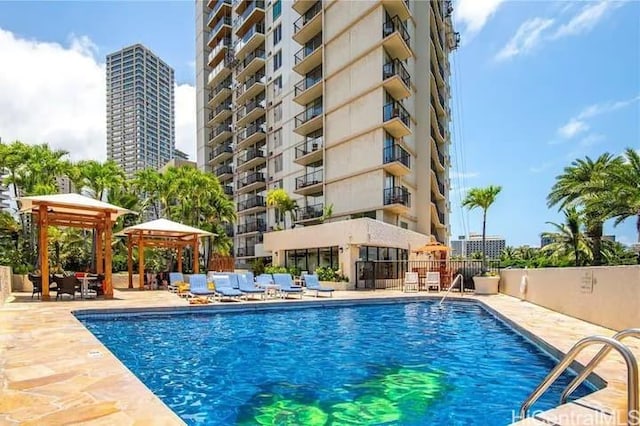 view of pool featuring a gazebo and a patio