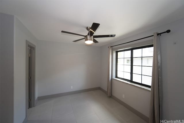 unfurnished room with ceiling fan