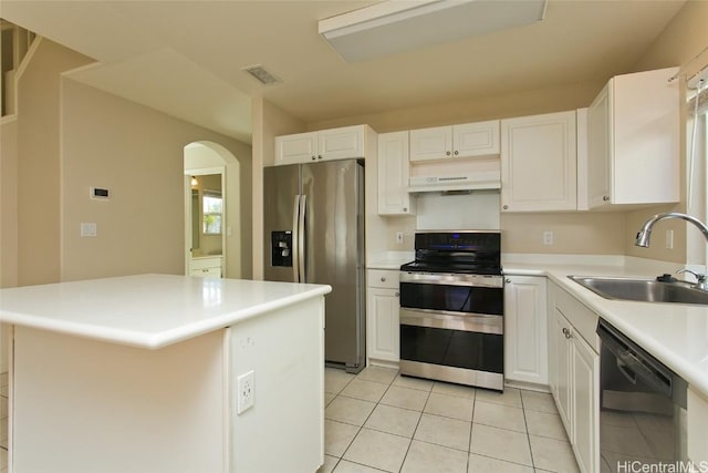 kitchen with light tile patterned flooring, white cabinetry, sink, and appliances with stainless steel finishes