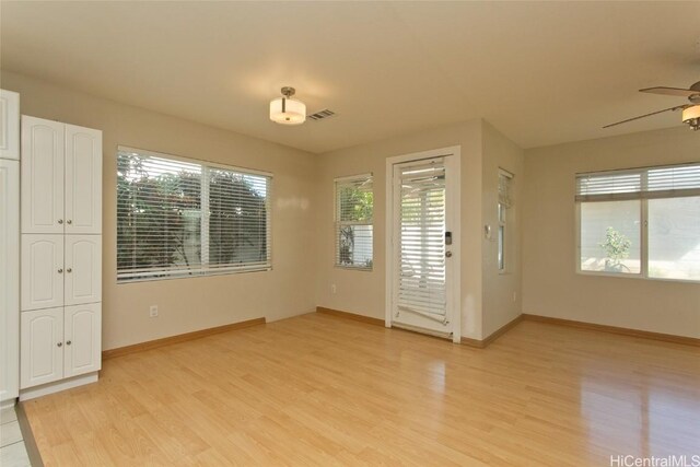 interior space with ceiling fan and light hardwood / wood-style floors