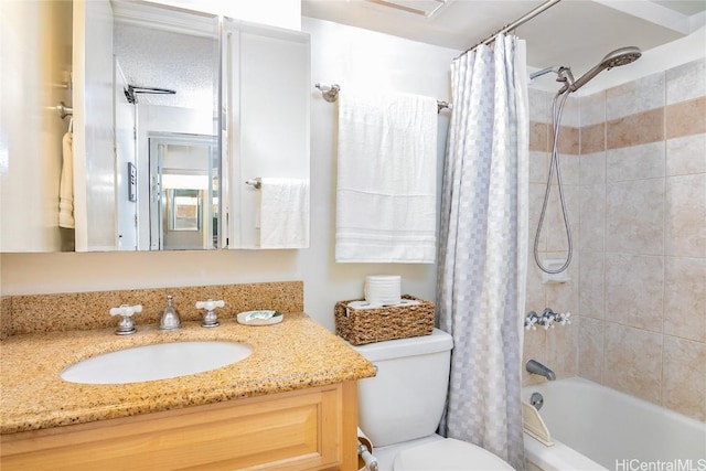 full bathroom with vanity, toilet, and shower / bath combo with shower curtain