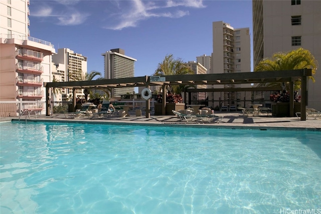 view of swimming pool with a pergola and a patio