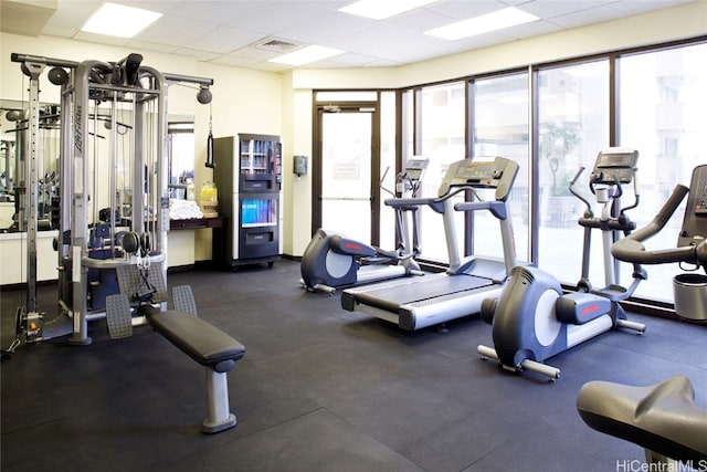 workout area with a paneled ceiling