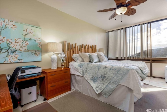 bedroom featuring light tile patterned floors and ceiling fan