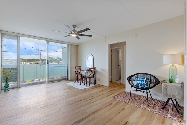 1046 Ehoeho Ave Unit 328, Wahiawa, HI 96786 - sitting room with light wood-type flooring, ceiling fan, and floor to ceiling windows