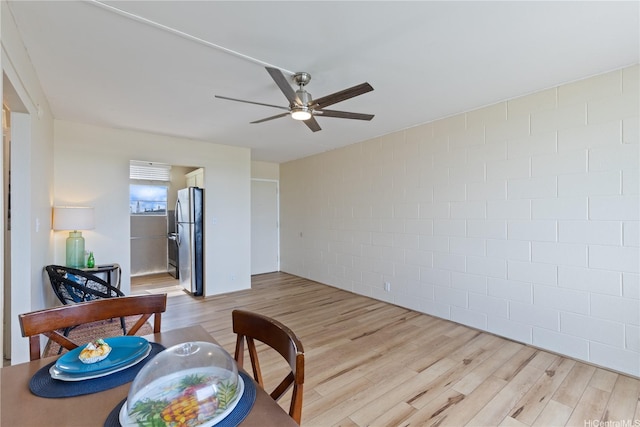 1046 Ehoeho Ave Unit 328, Wahiawa, HI 96786 - living area with light wood finished floors, a ceiling fan, and concrete block wall
