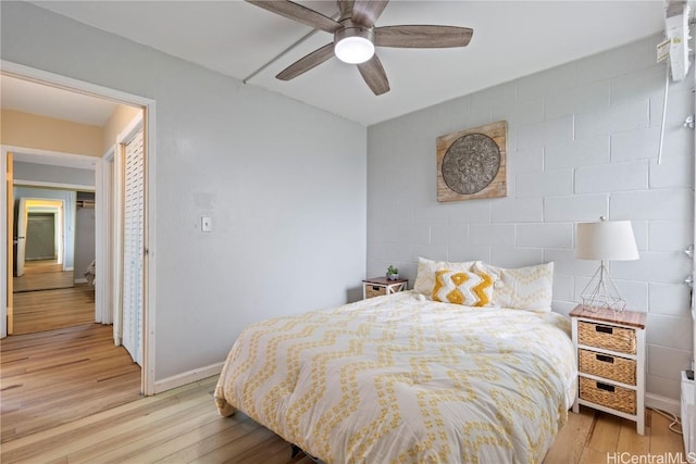 bedroom featuring ceiling fan and light hardwood / wood-style flooring