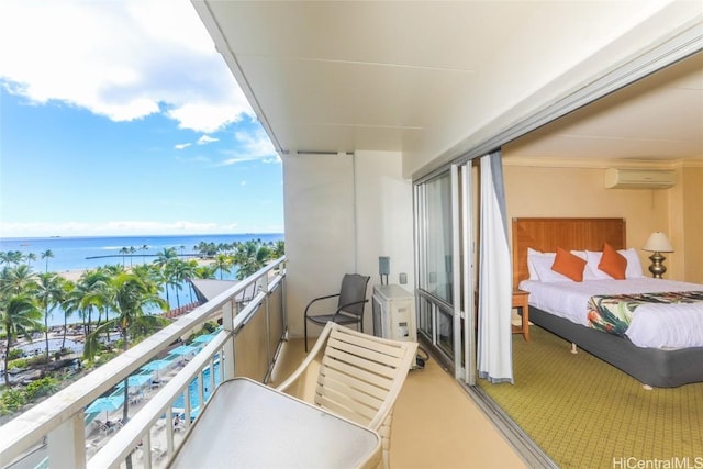 balcony featuring a water view and an AC wall unit