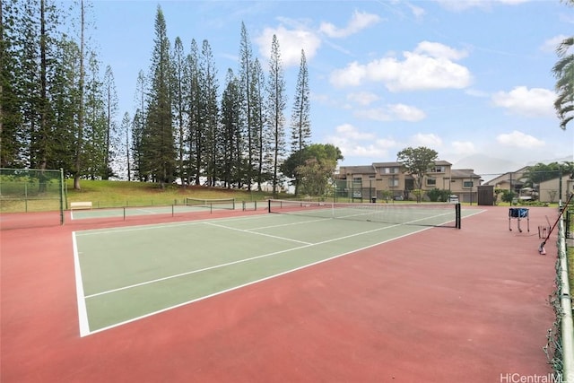 view of tennis court featuring basketball hoop