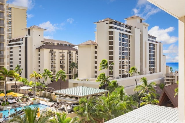 view of property with a water view and a community pool