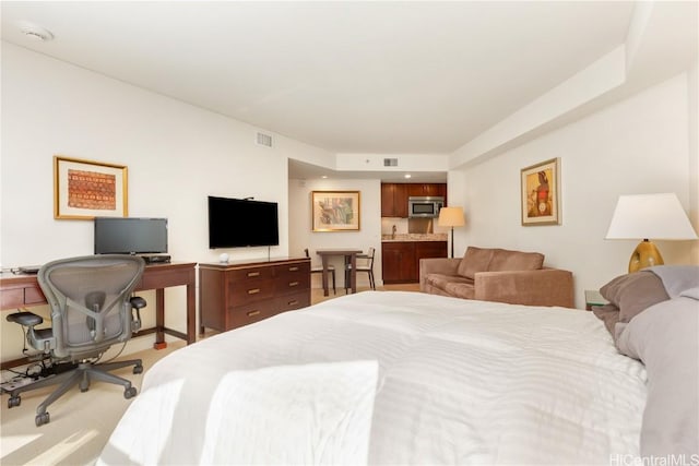 bedroom with light colored carpet