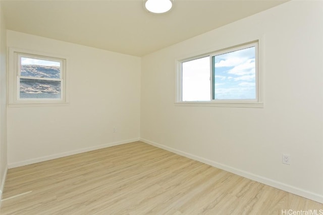 unfurnished room featuring light wood-type flooring