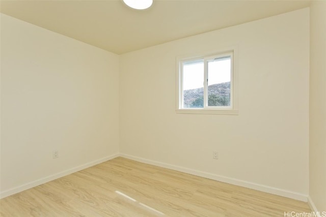 unfurnished room with light wood-type flooring