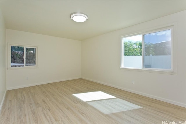 unfurnished room with light hardwood / wood-style floors