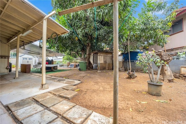 view of yard with a storage unit