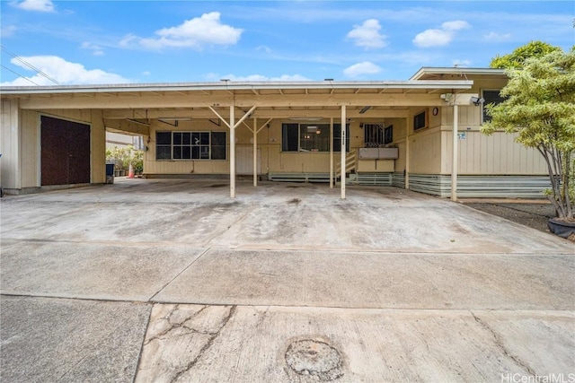 exterior space with a carport