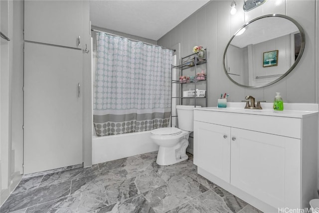 full bathroom featuring vanity, shower / bath combination with curtain, and toilet