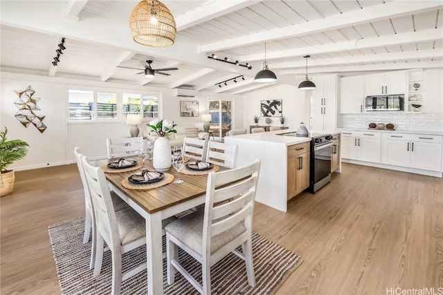 dining space featuring an AC wall unit, ceiling fan, beamed ceiling, and light hardwood / wood-style floors