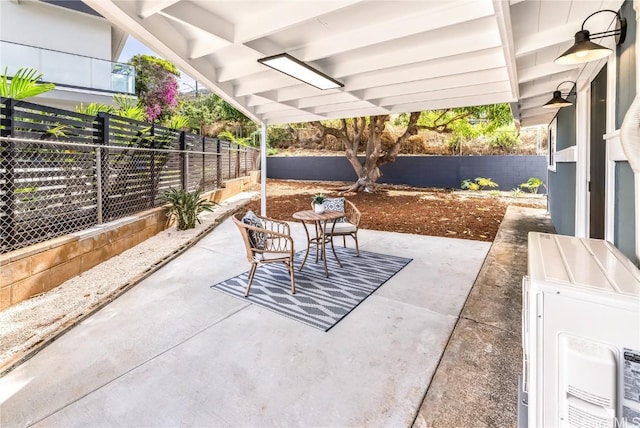 view of patio featuring ceiling fan