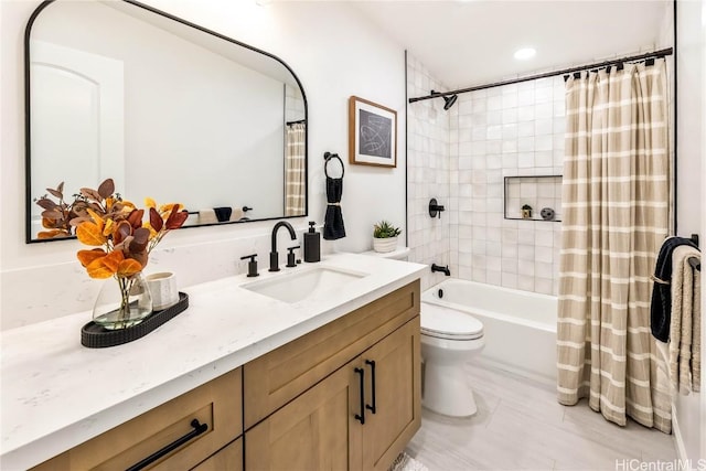 full bathroom with vanity, toilet, and shower / tub combo with curtain